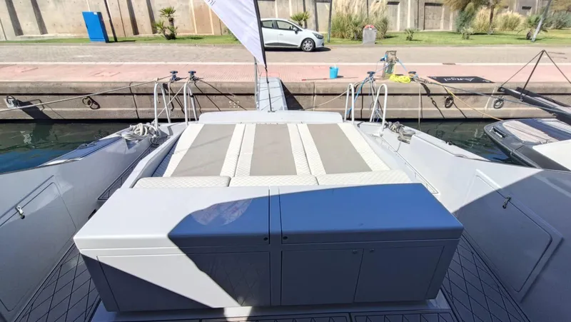  Yacht Photos Pics Otam 55 Millenium 1998 yacht deck with sunbathing area at a marina.