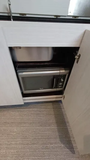  Yacht Photos Pics Microwave inside cabinet of 1998 Otam 55 Millenium yacht kitchen.