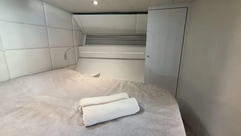  Yacht Photos Pics Luxurious cabin interior of 1998 Otam 55 Millenium yacht with neatly folded towels.