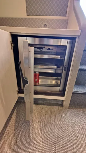  Yacht Photos Pics Stainless steel mini fridge in 1998 Otam 55 Millenium yacht interior.