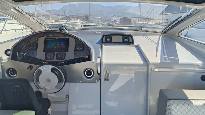  Yacht Photos Pics Cockpit of 1998 Otam 55 Millenium yacht with modern controls and panoramic view.