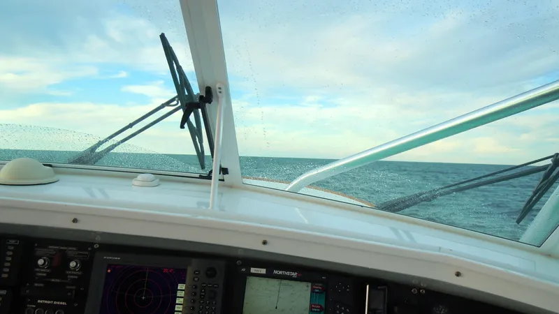 Waterproof Yacht Photos Pics View from Davis 45 Express 2001 boat cockpit, showing ocean horizon and navigation instruments.