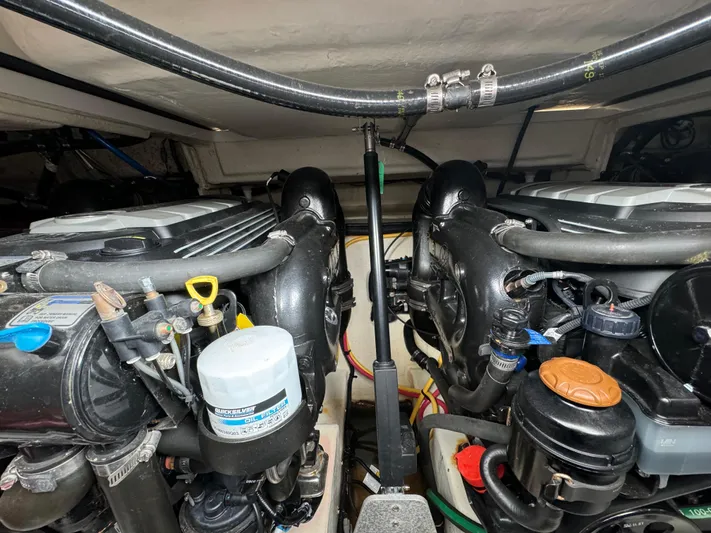 Kaja Yacht Photos Pics Engine compartment of a 2018 Monterey 335 SY boat, showcasing dual engines and components.