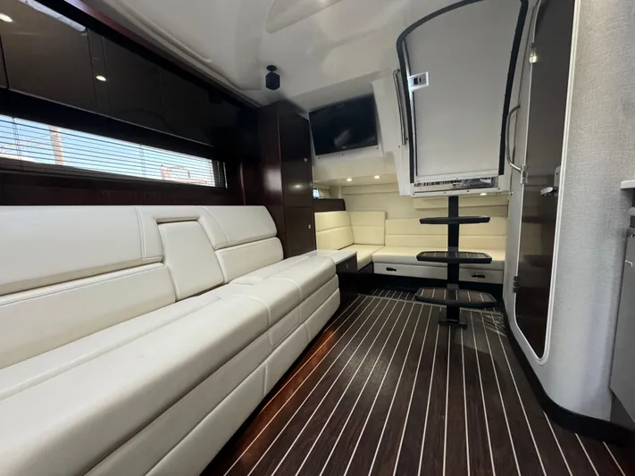 Kaja Yacht Photos Pics Luxurious interior of a 2018 Monterey 335 SY yacht with sleek seating and modern design.