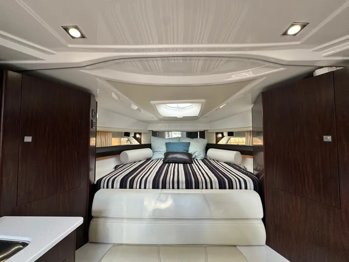 Kaja Yacht Photos Pics Luxurious interior of 2018 Monterey 335 SY yacht with elegant bedding and modern design.