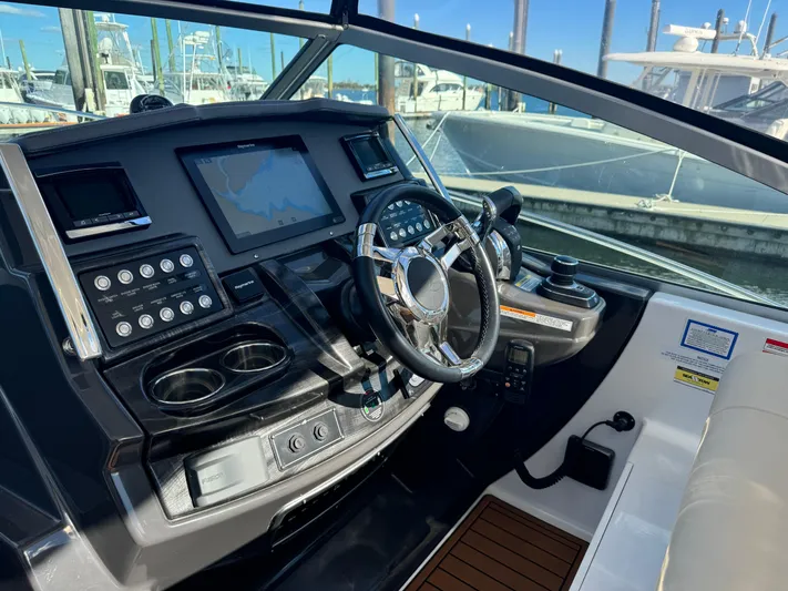 Kaja Yacht Photos Pics 2018 Monterey 335 SY boat cockpit with modern controls and steering wheel.