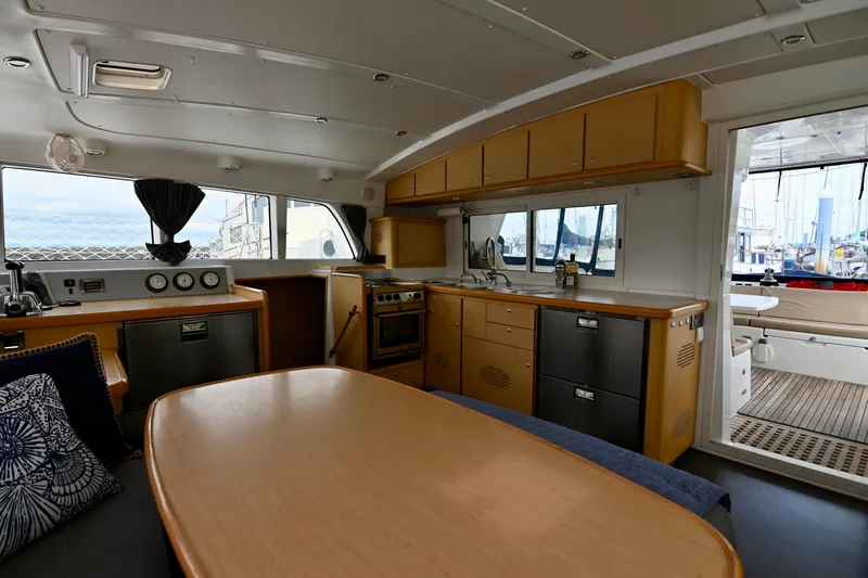  Yacht Photos Pics Interior of 2009 Lagoon 440 catamaran with modern kitchen and dining area.