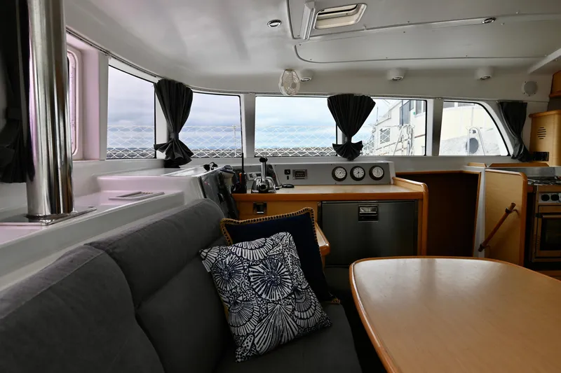  Yacht Photos Pics Interior of 2009 Lagoon 440 catamaran with modern seating and navigation equipment.