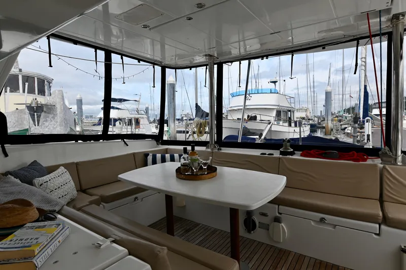  Yacht Photos Pics Interior of 2009 Lagoon 440 catamaran with seating area and marina view.