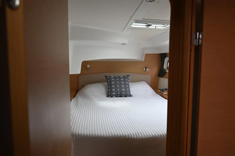  Yacht Photos Pics Cozy bedroom interior of 2009 Lagoon 440 yacht with a neatly made bed.