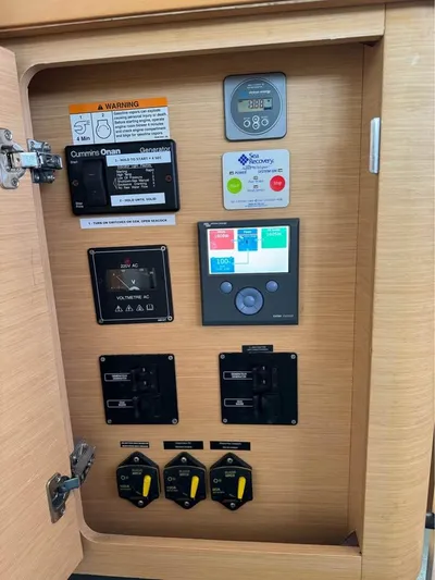  Yacht Photos Pics Electrical control panel inside 2009 Lagoon 440 yacht, featuring various switches and gauges.