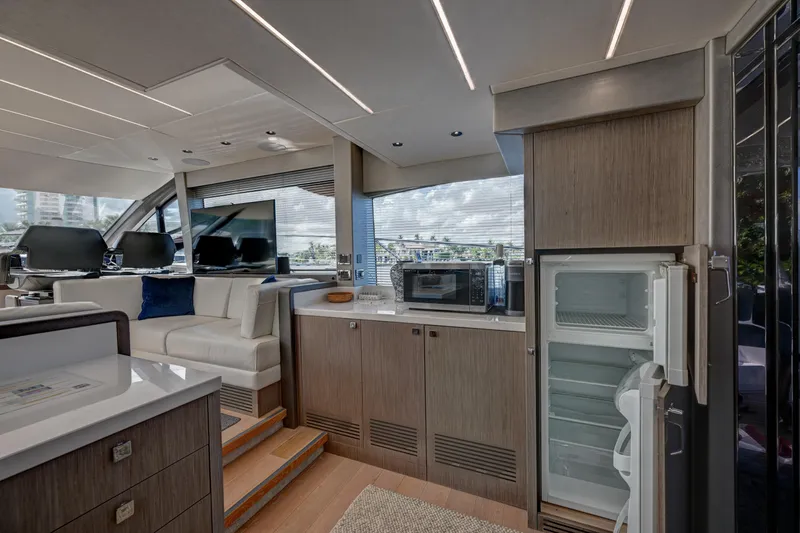  Yacht Photos Pics Luxurious interior of 2020 Sunseeker Manhattan 52 yacht with modern kitchen amenities.