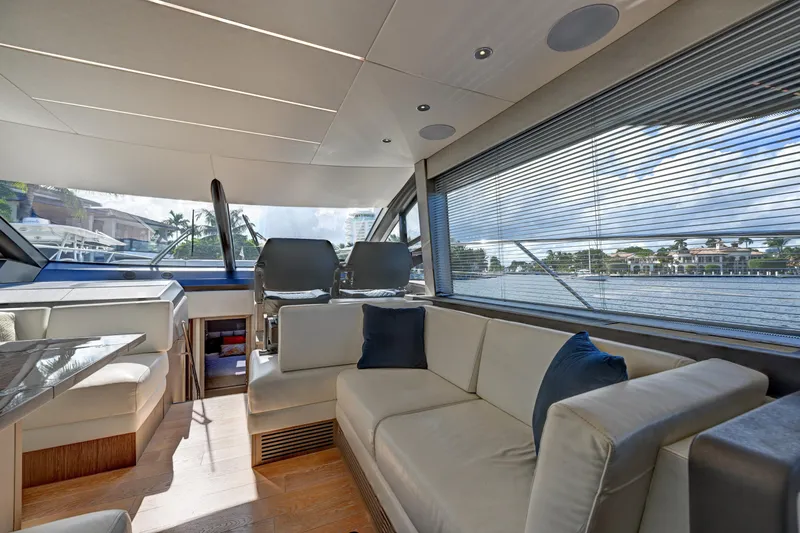  Yacht Photos Pics Luxurious interior of 2020 Sunseeker Manhattan 52 yacht with elegant seating and panoramic windows.