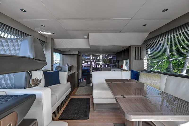  Yacht Photos Pics Luxurious interior of 2020 Sunseeker Manhattan 52 yacht with modern seating and dining area.