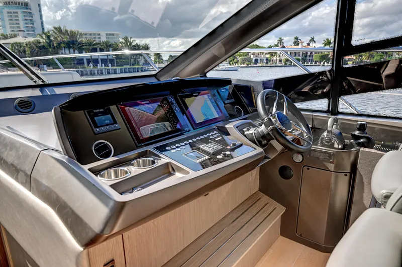  Yacht Photos Pics 2020 Sunseeker Manhattan 52 yacht helm with advanced navigation systems and luxurious interior.