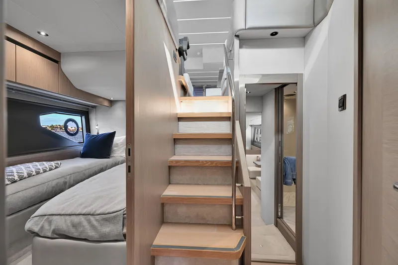  Yacht Photos Pics Luxurious interior of 2020 Sunseeker Manhattan 52 yacht with modern staircase and cozy cabin.