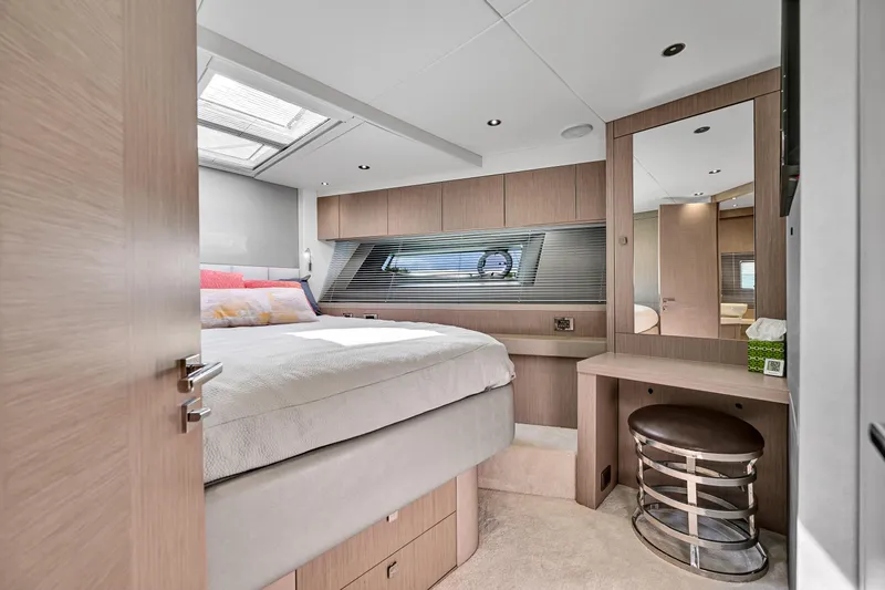 Yacht Photos Pics Luxurious bedroom interior of 2020 Sunseeker Manhattan 52 yacht, featuring modern design and natural light.
