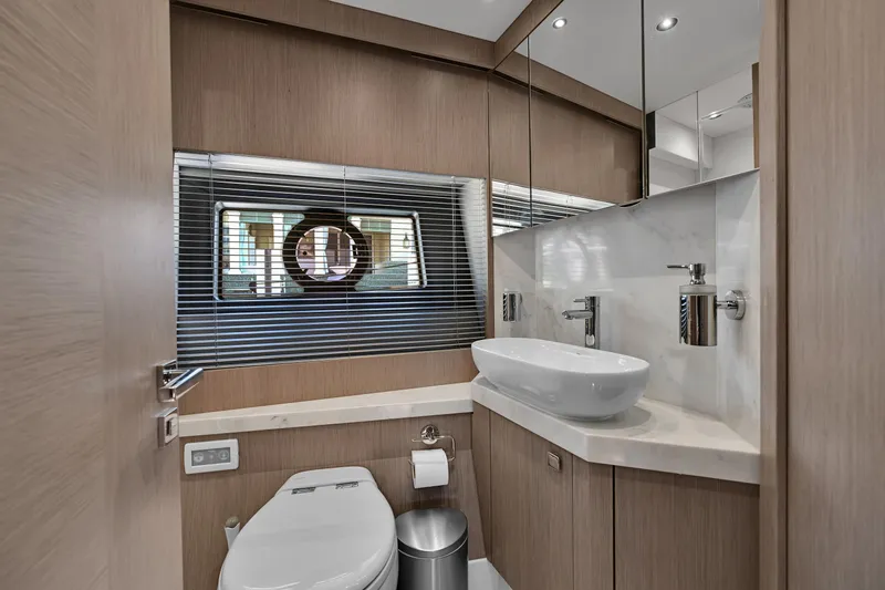  Yacht Photos Pics Luxurious bathroom in 2020 Sunseeker Manhattan 52 yacht with modern fixtures and elegant design.