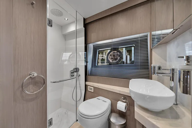  Yacht Photos Pics Luxurious bathroom in 2020 Sunseeker Manhattan 52 yacht with modern fixtures and elegant design.