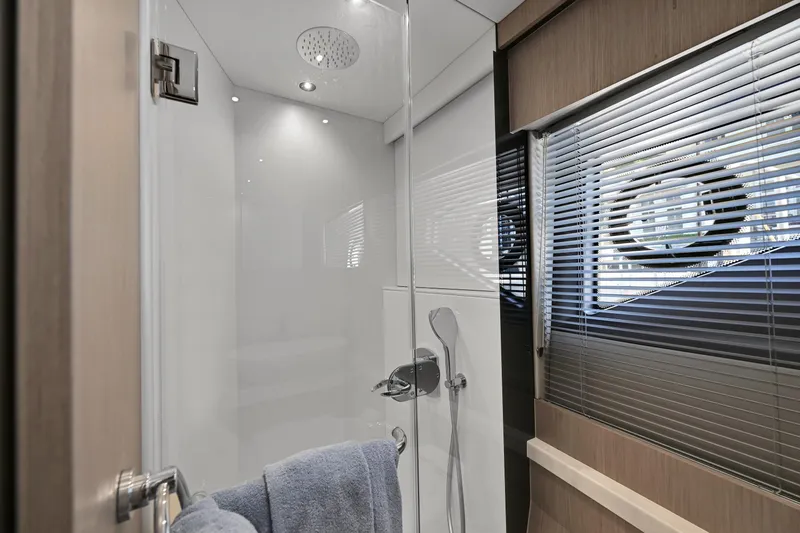  Yacht Photos Pics Luxurious bathroom in 2020 Sunseeker Manhattan 52 yacht with modern shower and window blinds.