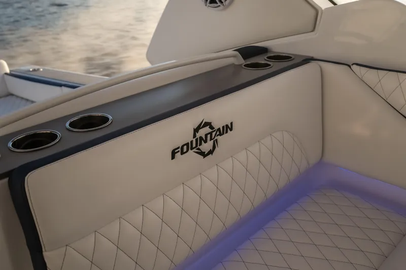  Yacht Photos Pics Luxurious interior of 2026 Fountain 39 DX boat with elegant seating and cup holders.