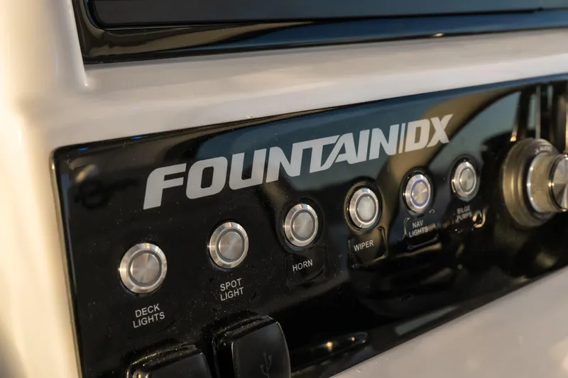  Yacht Photos Pics Control panel of 2026 Fountain 39 DX boat with labeled buttons and switches.