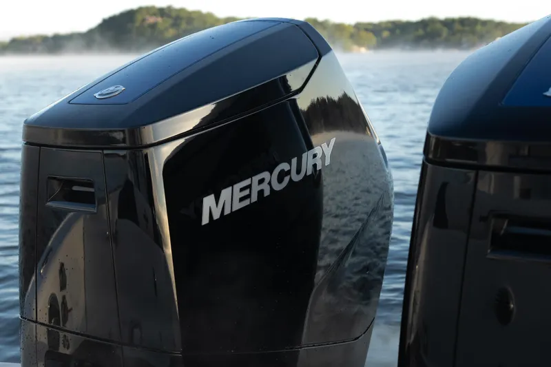 Yacht Photos Pics Mercury outboard engines on a 2026 Fountain 39 DX boat, with scenic water backdrop.