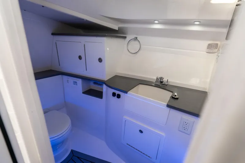  Yacht Photos Pics Modern bathroom interior of 2026 Fountain 39 DX boat, featuring sleek design and efficient layout.