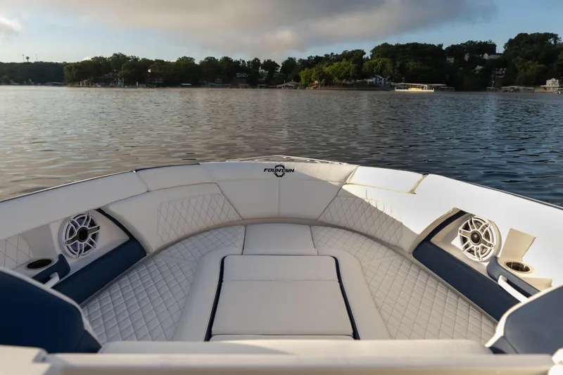  Yacht Photos Pics Luxurious 2026 Fountain 39 DX boat interior with quilted seating on a serene lake.