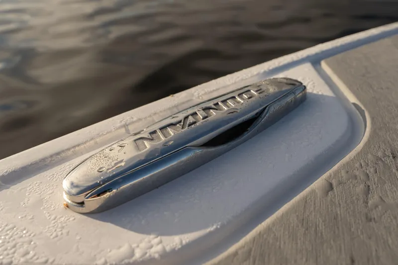  Yacht Photos Pics Close-up of a 2026 Fountain 39 DX boat cleat with water droplets.