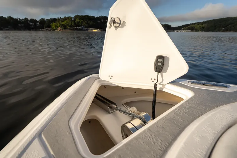  Yacht Photos Pics Open anchor compartment on 2026 Fountain 39 DX boat, with scenic lake view.