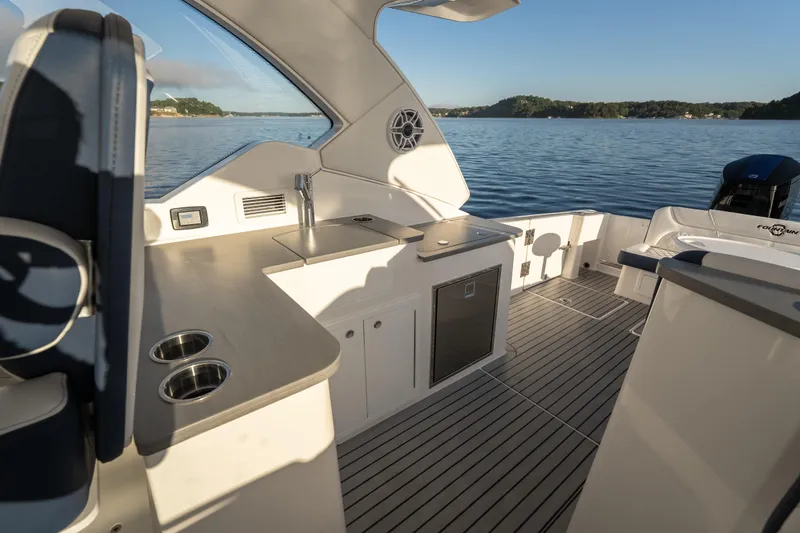  Yacht Photos Pics Luxurious 2026 Fountain 39 DX boat interior with sleek kitchen and scenic water view.
