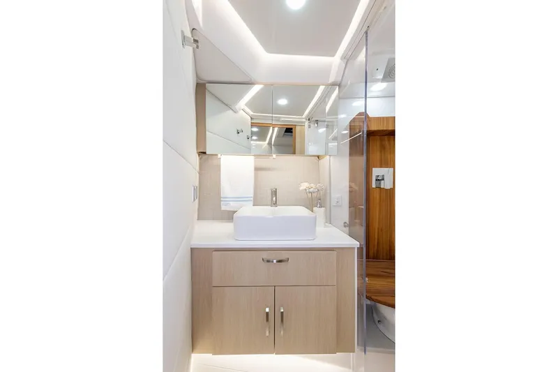  Yacht Photos Pics Manufacturer Provided Image: Luxurious bathroom in 2026 Regal 36 Grande Coupe yacht, featuring modern fixtures and elegant design.