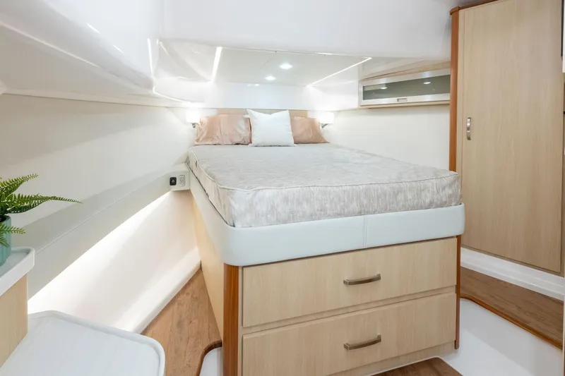  Yacht Photos Pics Manufacturer Provided Image: Luxurious cabin interior of 2026 Regal 36 Grande Coupe yacht with bed and storage.
