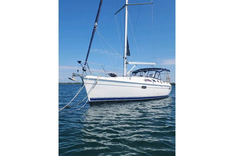 Seaquel Yacht Photos Pics Sailboat on water, 2003 Hunter 386 model, clear blue sky background.
