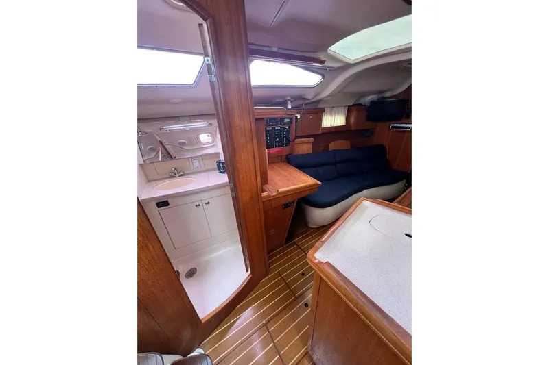 Seaquel Yacht Photos Pics Interior of 2003 Hunter 386 sailboat with wood finish and compact living area.