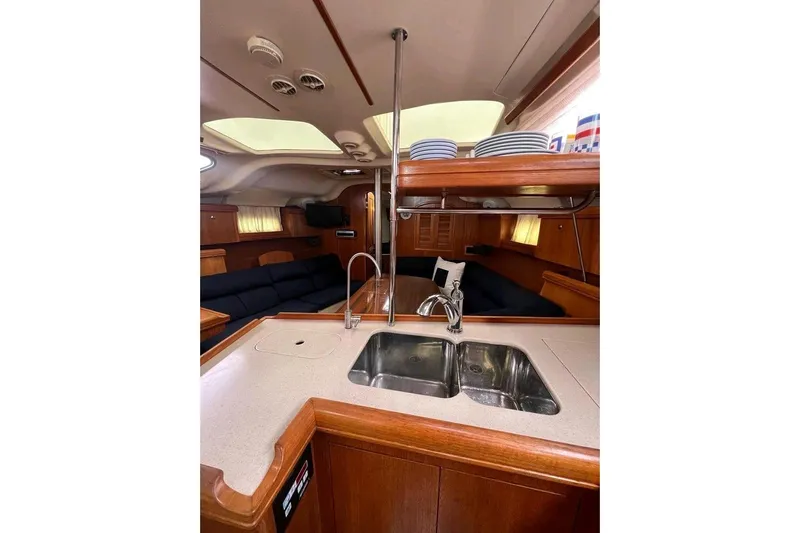 Seaquel Yacht Photos Pics Interior of 2003 Hunter 386 yacht with modern kitchen and cozy seating area.