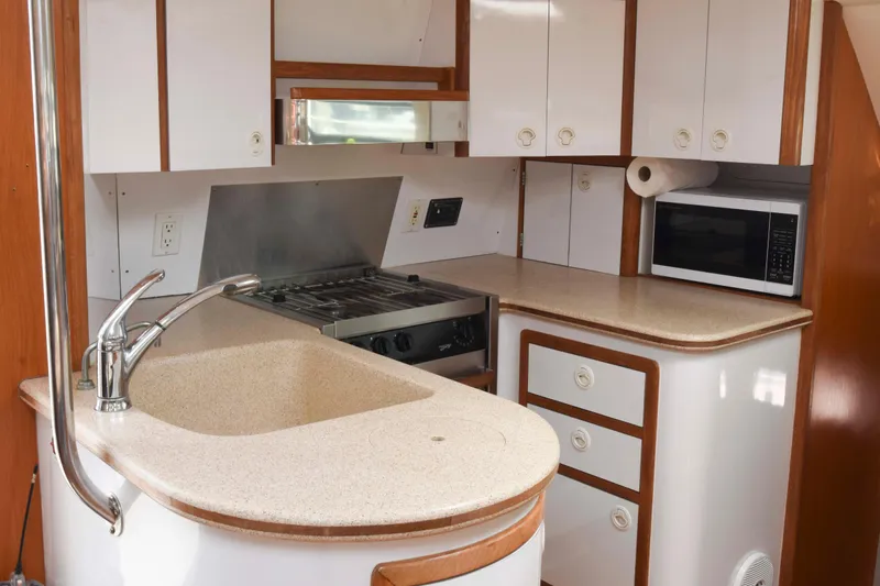Sangaris Yacht Photos Pics 2005 Manta 42 MkII yacht kitchen with stove, microwave, and sink.