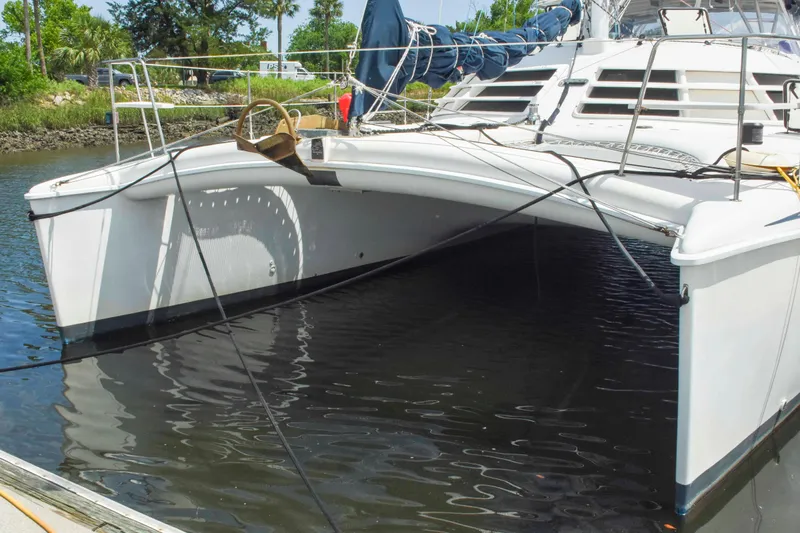 Sangaris Yacht Photos Pics 2005 Manta 42 MkII catamaran docked in calm waters.