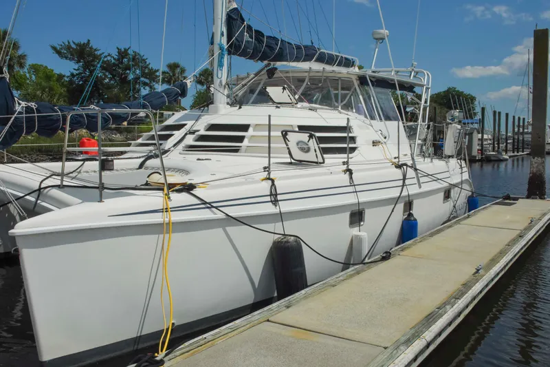 Sangaris Yacht Photos Pics 2005 Manta 42 MkII catamaran docked at marina under clear blue sky.