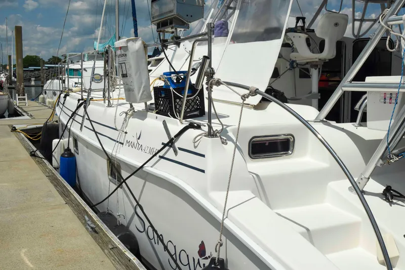 Sangaris Yacht Photos Pics 2005 Manta 42 MkII catamaran docked at marina under blue sky.