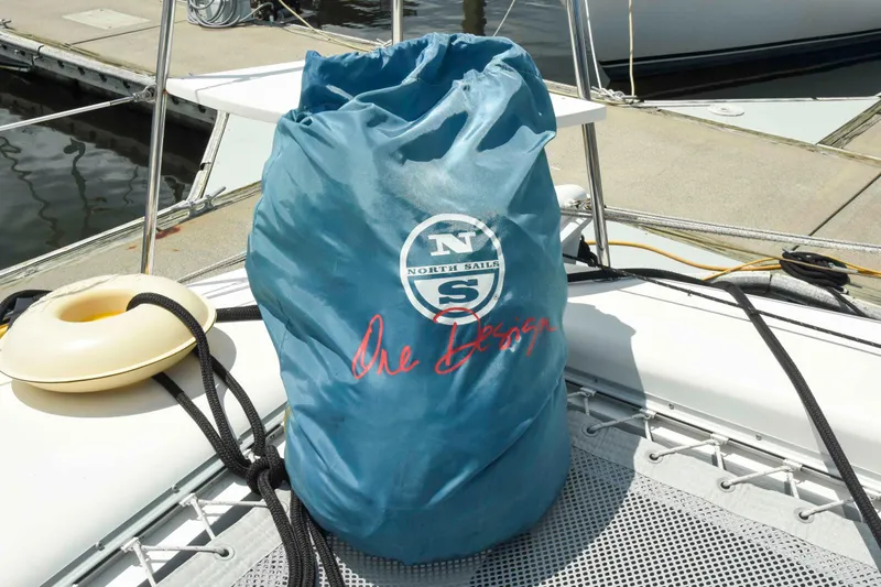 Sangaris Yacht Photos Pics Blue sail bag on 2005 Manta 42 MkII catamaran deck, dockside background.