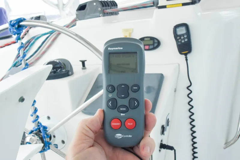 Sangaris Yacht Photos Pics Hand holding Raymarine remote on 2005 Manta 42 MkII yacht cockpit.