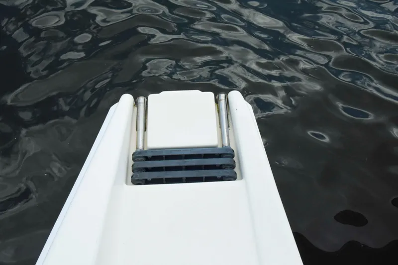 Sangaris Yacht Photos Pics Boarding ladder of 2005 Manta 42 MkII yacht over water.