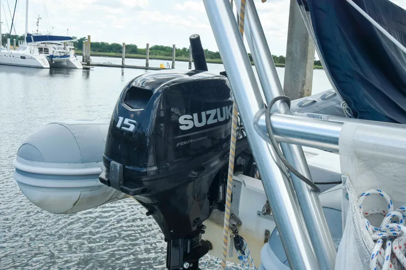 Sangaris Yacht Photos Pics Outboard motor on 2005 Manta 42 MkII sailboat docked at marina.