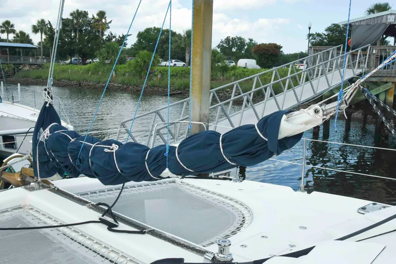 Sangaris Yacht Photos Pics 2005 Manta 42 MkII sailboat docked with wrapped sail and marina background.