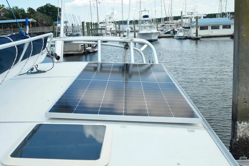 Sangaris Yacht Photos Pics Solar panel on 2005 Manta 42 MkII catamaran docked at marina.