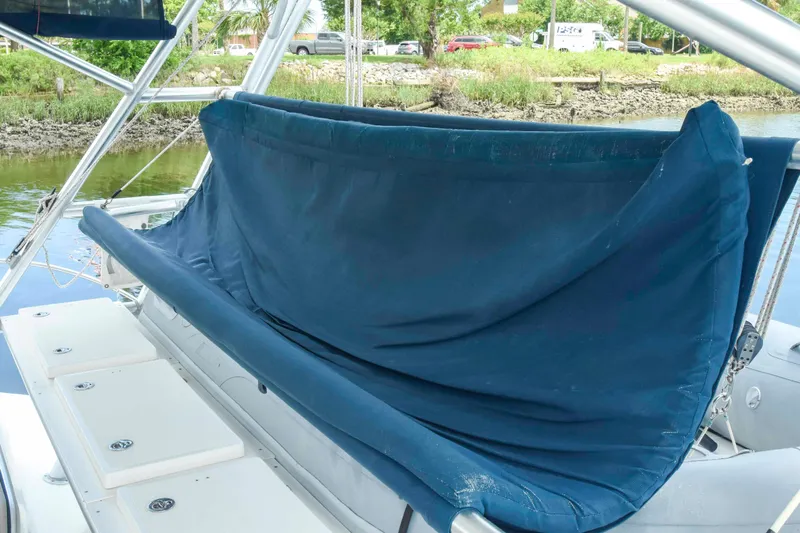 Sangaris Yacht Photos Pics 2005 Manta 42 MkII sailboat with blue canvas cover on deck.