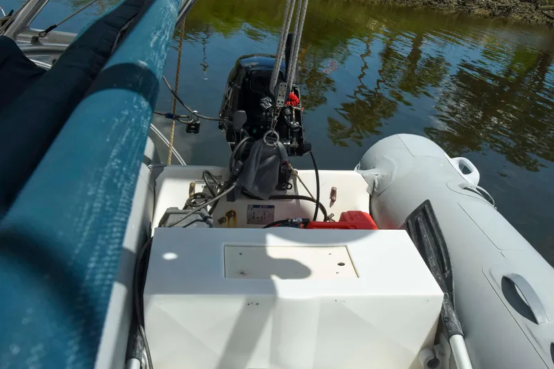 Sangaris Yacht Photos Pics 2005 Manta 42 MkII sailboat with outboard motor and inflatable dinghy on calm water.