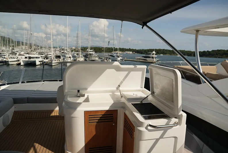  Yacht Photos Pics Sunseeker Manhattan 66 yacht deck with outdoor kitchen, marina view, 2017 model.